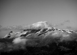 Swiss mountain peaks with clouds poster