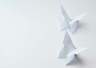 White origami butterflies on white background poster